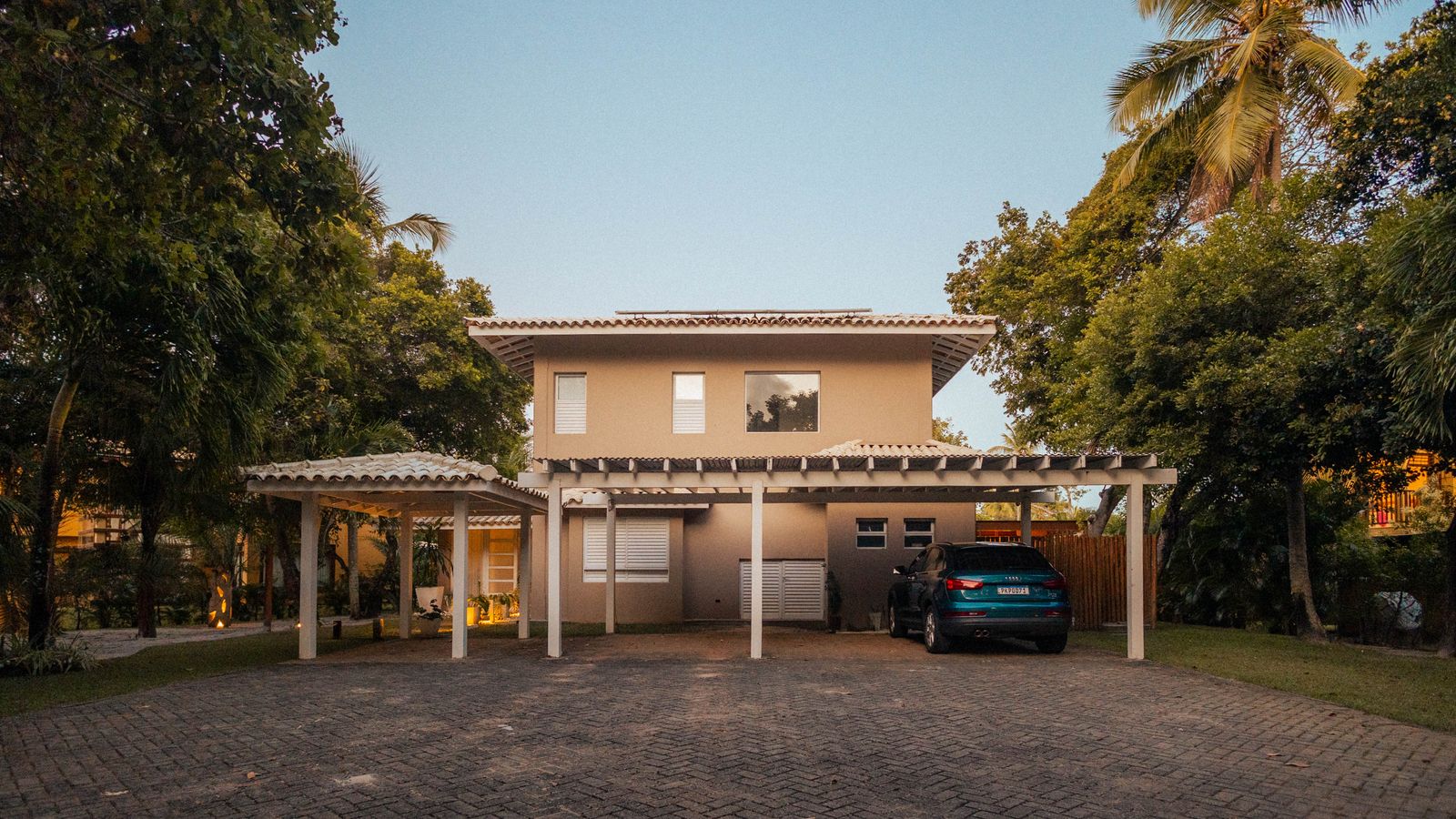 Modern tropical home at sunset
